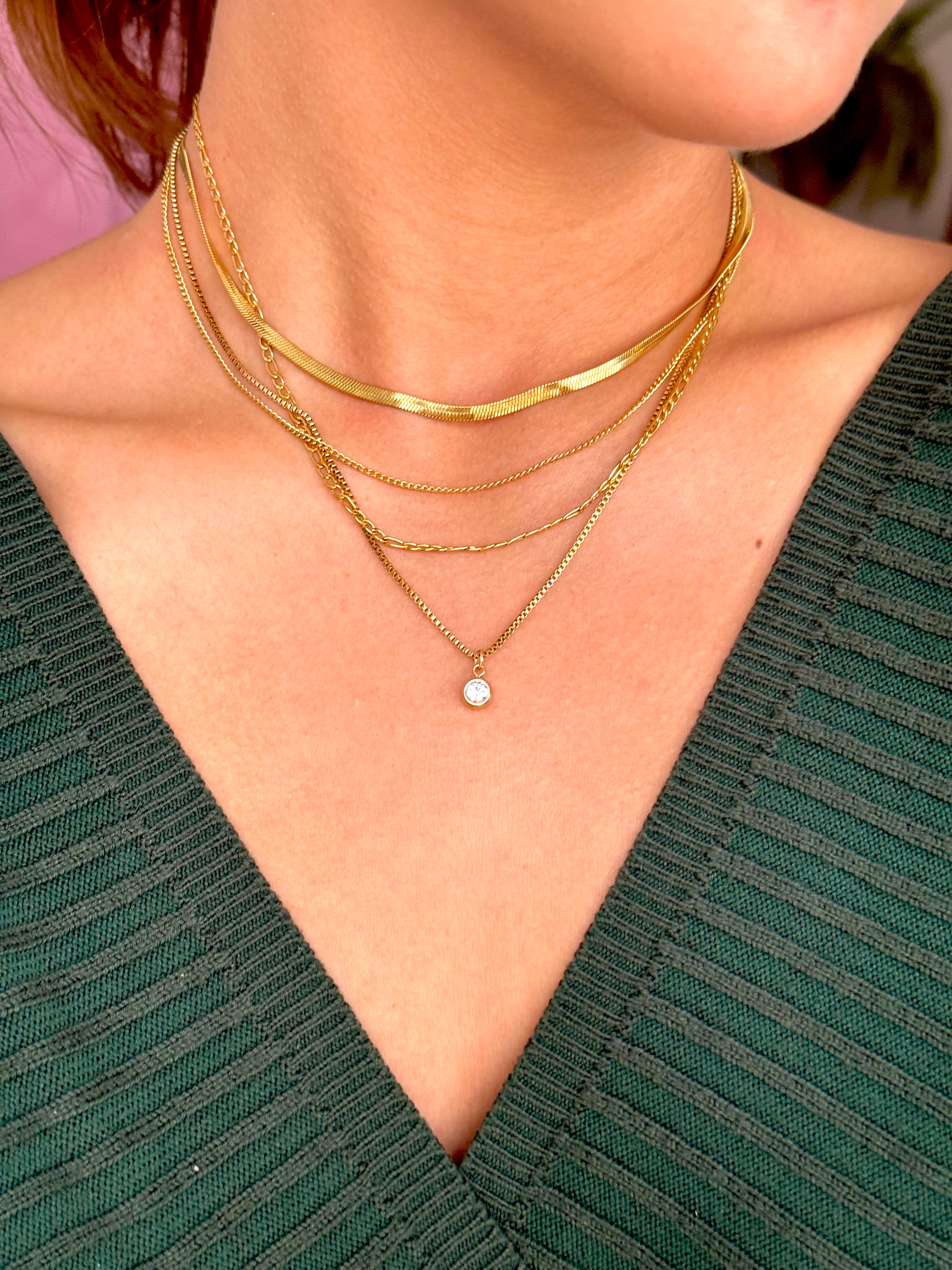 COLLAR CON CUATRO CADENAS Y CIRCONITA REDONDA TRANSPARENTE