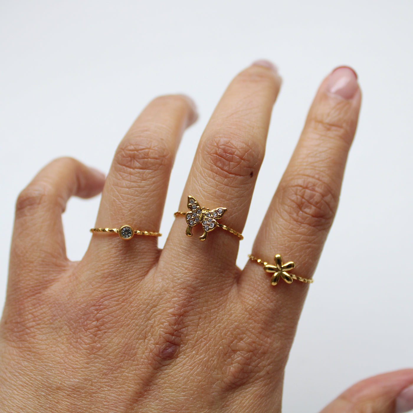 SET DE TRES ANILLOS (FLOR, CIRCONITA Y MARIPOSA)